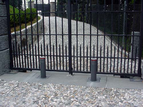 Rising bollards as added security for automatic gates