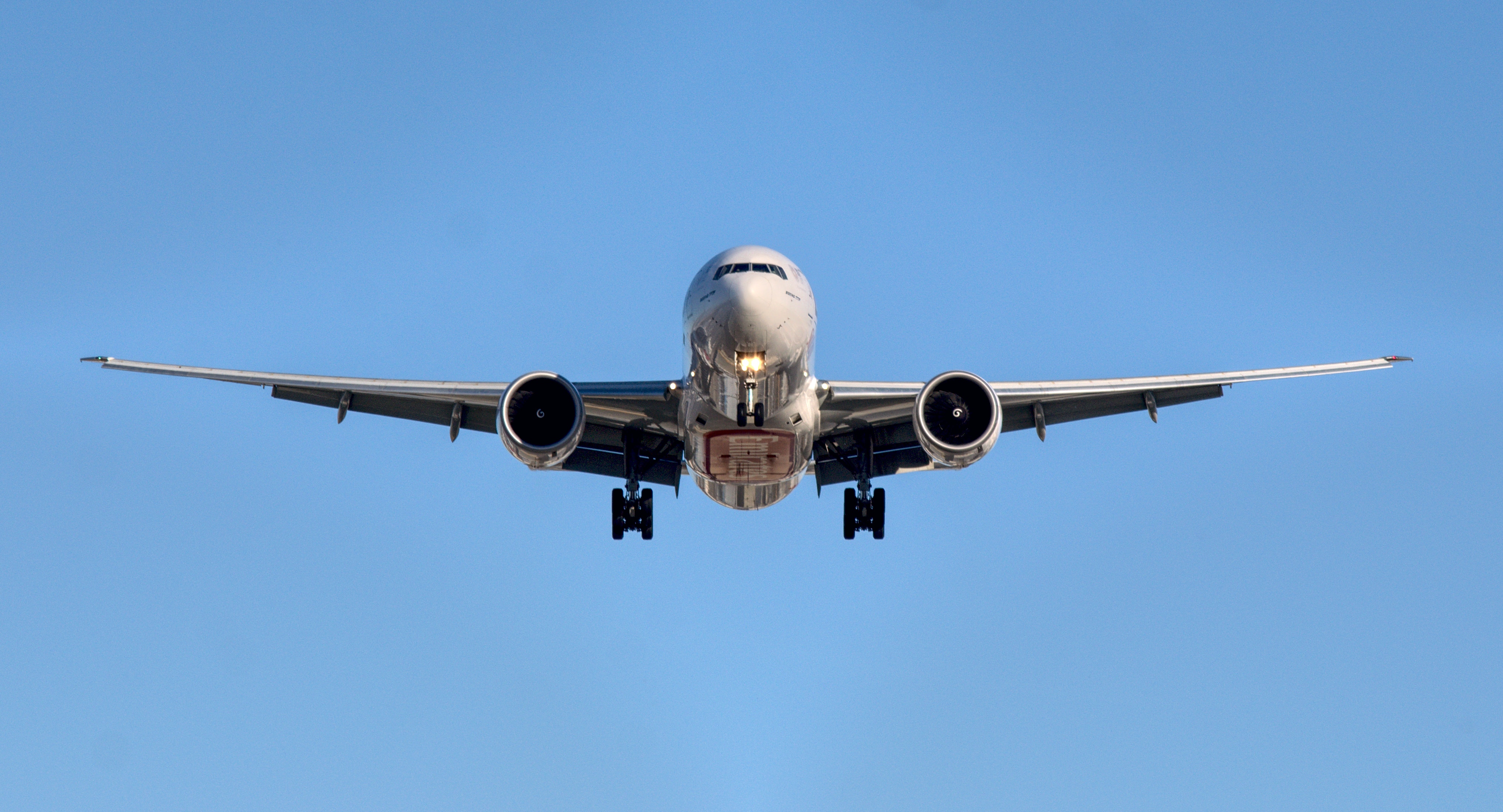 airplane taking off in the blue sky
